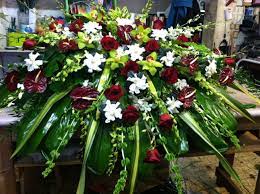 Sympathy flowers themed in red. Casket Spray Burgundy And White Casket Sprays Sympathy Flowers Funeral Flowers