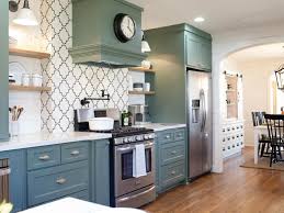 Have you ever thought of the colour sage green? Country Kitchen With Sage Green Cabinetry Patterned Tile Backsplash And Hardwood Flooring Hgtv