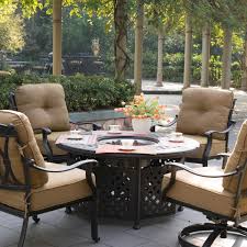 Exterior Black Wicker Armchairs With Striped Cushions And Round Costco Fire Pit On Wooden F Outdoor Furniture Fire Pit Table And Chairs Costco Patio Furniture