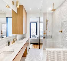 penny tiles and brass fixtures set the