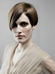 Vintage short hair styling with sharp lines and shimmering layers of colour