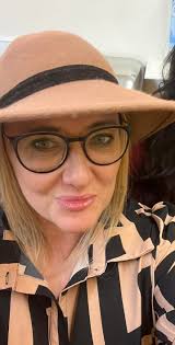 Hey all. Could someone please make this photo a little sharper? And also  move the glass in front of my friends face ? I do t even know if that is  possible