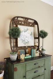 Green Books And Brass Console Table Decor Around Tv Brass Console Table Jug Decor