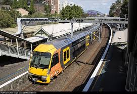 An Up Waratah Set Stops At Waverton Station On Sydney S North Shore Line With The Sydney Harbour Bridge Just Visible In New South Wales Train Train Pictures