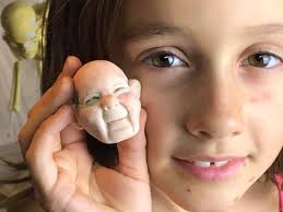 My daughter Julia LePine sculpted this face! She is only 7!!!! This girl is  freaking me out!!! She asked me to show her the steps of making Mrs. Claus,  I showed her