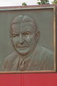 PHOTOS: Monument to Redskins founder, who has a racist legacy, removed from  outside RFK