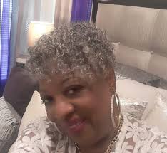 Mrs. Rucker emerged at night, adorned in a striking all-white ensemble.