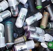 Empty paint spray cans used for graffiti and street art in a ...