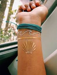 Our mission is to bring you a zen space, in a diverse & safe neighborhood, with friendly artists who live to create quality custom tattoos. 46 Most Astonishing White Ink Tattoos Media Democracy Seashell Tattoos Tattoo Bracelet Ink Tattoo