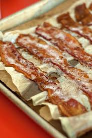 Oven Bacon I Always Cook Bacon In The Oven But I Ve Never Used Parchment Paper And A Paper Bag Have To Try This Perfect Oven Bacon Bacon In The Oven Recipes