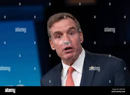 United States Senator Mark Warner (Democrat of Virginia) and Ms. Lisa Collis  arrive to attend a State Dinner in honor of Prime Minister Narendra Modi of  the Republic of India hosted by