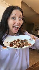 Black cat showing affection by sleeping near owner