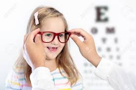 Child At Eye Sight Test Little Kid Selecting Glasses At Optician