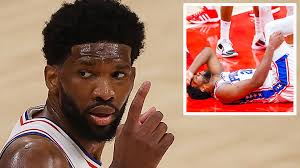 Joel embiid all eyes were on joel embiid as he retreated to the locker room with philadelphia 76ers general manager elton brand between the first and second quarters of game 4. 6j3q8 T4 Uqh0m