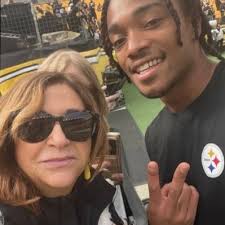 John comes in from the gym. “What time do they start playing  football..geez”.