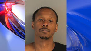 Man charged with double shooting and robbery