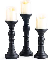 Whether you want to add a dash of romance to your decor, or need a seasonal touch, each floral candle centerpiece brings something different to the table. Amazon Com Resin Pillar Candle Holders Set Of 3 7 9 8 11 8 High Home Coffee Table Decor Decorations Centerpiece For Dining Living Room Gifts For Wedding Black Kitchen Dining