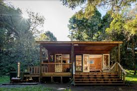 The decor is restful with colours of champagne, pearl and purple. River Cabin North Island Glamping Retreats