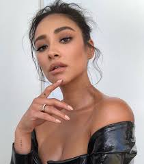 Letter "E" and roman numerals tattooed