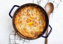 Pour reserved syrup over fruit. Dutch Oven Peach Cobbler Oven Or Campfire Recipe