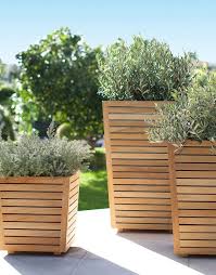Teak Planters With Plants On A Patio From Target Diy Wood Planters Tall Planters Diy Planters