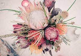 Gianna 100 Layer Cake Protea Centerpiece Sullivan Owen Floral Design Wedding Flowers Floral Wedding Bouquets