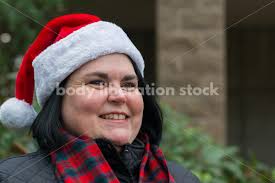 Stock Photo: Young Asian American Woman Holding Pine Branch
