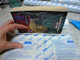 How To Cover A Paperback Book With Clear Plastic Film Book Cover Diy Plastic Book Covers Diy Book
