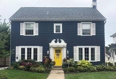 I like when a home's color scheme is welcoming and that's easily achieved with lighter colors. Exterior Paint Color With Bright Yellow Door