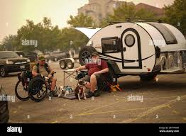 Kelowna, Canada. 19th Aug, 2023. Veteran Rob Pullen, left, and Warren Pullen,  who were evacuated from their home