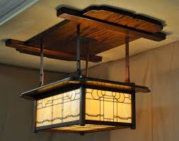 Crafted of solid hardwood, the chairs feature limed effects that enhance the contrast and character of the wood grain in the exposed legs, while the table is crafted of a mixture of solid and manufactured wood. Arts And Crafts Lighting Greene And Greene Pendents Craftsman Style Chandeliers Mission Lighting