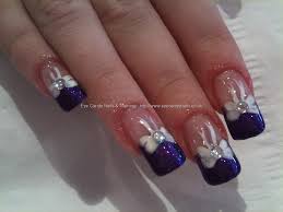 These nails do just that with their black matte center nail leading out to a tarnished black and purple nail and finally ending with an explosion of pretty purple glitter. White Nails With Glitter Tips Nail And Manicure Trends