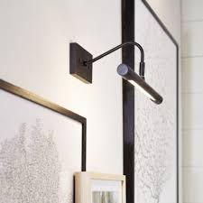 If you prefer a look that blends in a bit more, consider an. Art Display Picture Light