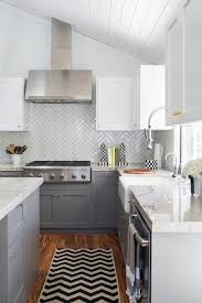 A Chevron Runner Sits Between A Gray Kitchen Island And Gray Shaker Cabinets Topped With White Mac Herringbone Tiles Kitchen Kitchen Design Small Kitchen Tiles