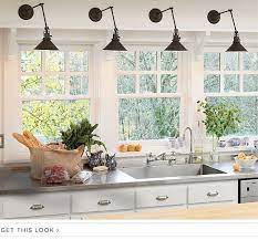 The shelf is a key to make a plain and empty wall more interesting. Image Result For Kitchens Rejuvenation Lighting Kitchen Wall Lights Kitchen Sink Lighting Kitchen Wall
