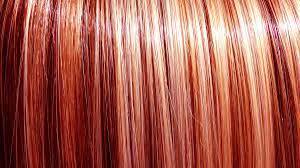 The hair has a lot of curls. Blonde Highlights On Red Dyed Hair And How To Go About This
