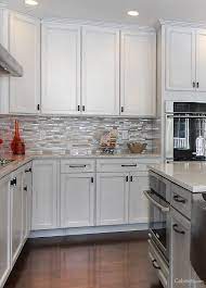 The cabinetry chooses the white and brown cupboards and the drawers. White And Gray Cabinets Are Perfect If You Want A Subtle Two Toned Kitchen Assembled Kitchen Cabinets Online Kitchen Cabinets Ready Made Kitchen Cabinets