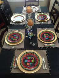 The charger may be used as a place to rest name cards, napkins or menu cards prior to the dinner. Birthday Party Table Decor Using Chargers Under Decorative Paper Plates And Silver Plasticware Make Birthday Party Tables Party Table Decorations Plastic Ware