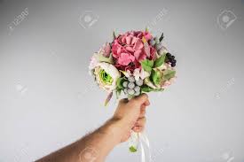 You get to choose every flower and ornament. Male Hand Giving Wedding Bouquet First Person View Stock Photo Picture And Royalty Free Image Image 60662285