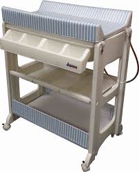 Two week old newborn baby boy sleeping on a tiny inflatable swim ring. Jojobug Bath Unit Ocean Stripe Baby City