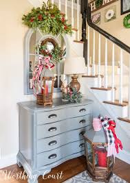 Pinterest aside from two lighted christmas trees next to the front door, this cozy entryway decoration idea inspires one to play with little gnome figurines and a diy santa. Warm And Welcoming Christmas Entryway Worthing Court