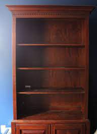 Bookshelf why use a library mod? Lighten Up A Dark Bookcase Without Paint Home Office Makeover The Inspired Room Dark Wood Bookcase Dark Wood Stain Wood Bookshelf Makeover