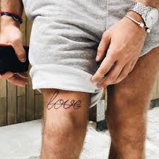 Word Love Tattooed Above The Right Knee Knee Tattoo Upper Leg Tattoos Thigh Tattoo Men