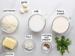 Add cream and simmer for 5 minutes, then add garlic and cheese and whisk quickly, heating through. Easy Alfredo Sauce Recipe Little Sunny Kitchen