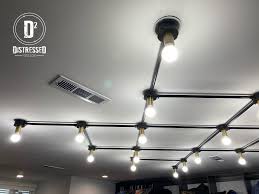 Troffers are rectangular light fixtures that fit into a modular dropped ceiling grid such as the gyproc grid track lights can be easily understood as a series of spot lights arranged on a linear track. Flush Mount Grid Light Distressed Design Light Ceiling Lights Ceiling Grid