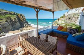 Surrounding lisbon are some of portugal's finest beaches, and during the summer, a trip to the beach is a wonderful addition to your holiday. Stunning Beach House On The Cliff Houses For Rent In Colares Lisboa Portugal Beach House Vacation Beach House Rental Beachfront House