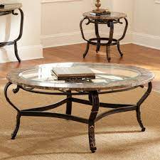Metal trim around table top with glass inset at bottom shelf. 30 Glass Coffee Tables That Bring Transparency To Your Living Room Coffee Table Round Metal Coffee Table Glass Table Living Room