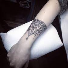 Mandala tattoos look great on women but adding a hint of white to it, now that is something great! 54 Mandala Bracelet Tattoo Ideas Tattoos Body Art Tattoos Tattoo Designs