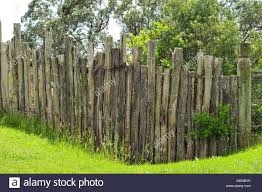 Fence and wooden pole with wild flowers. Fence Made Of Wooden Poles Stock Photo Royalty Free Image 113567095 Alamy Garden Poles Landscape Projects Wooden Poles