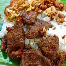 Urutan babi asap base genep (kuning) Bu Manik Nasi Jinggo Babi Kecap Balinese Restaurant In Kuta